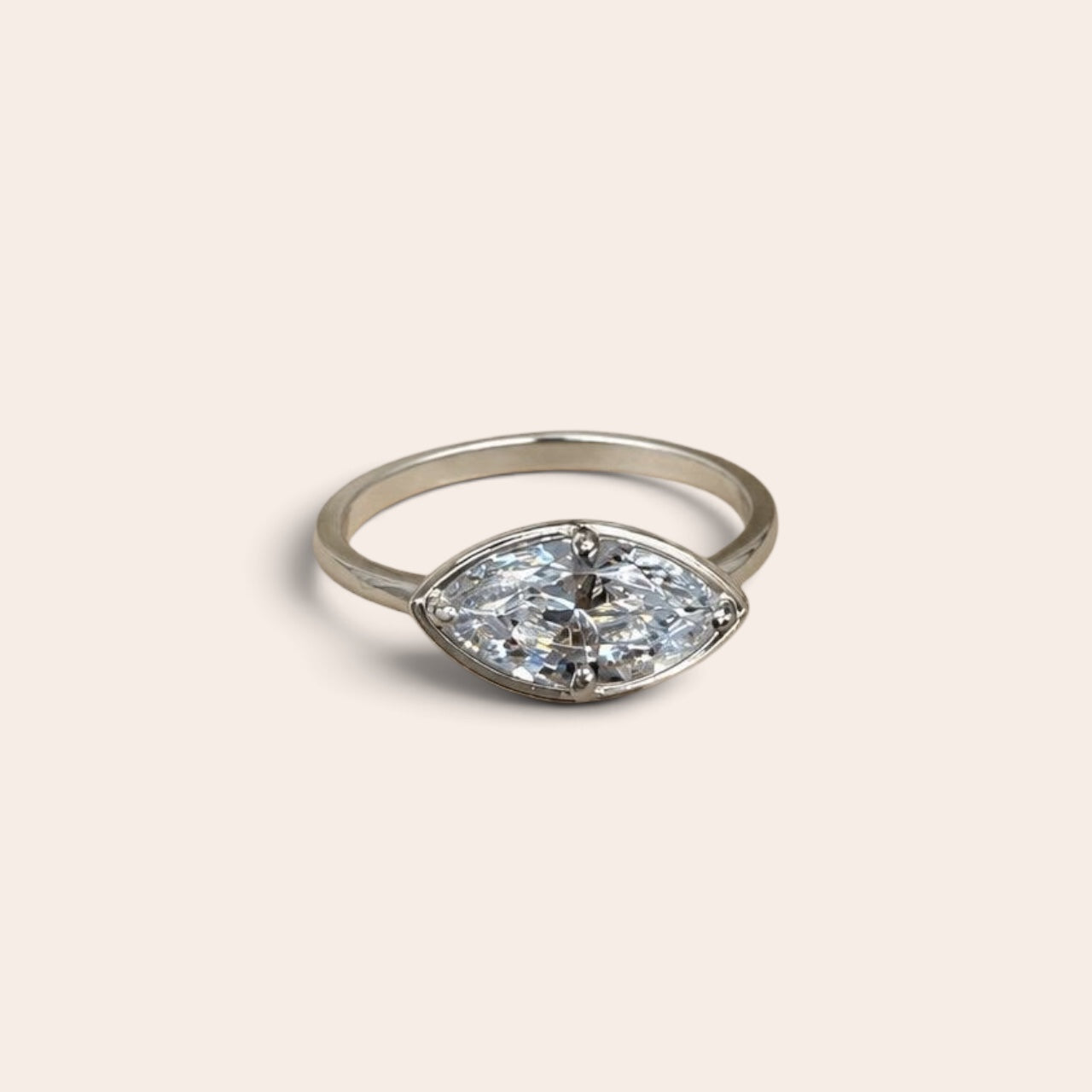 1.5 carat marquise diamond ring in solid 14K gold, featuring a modern east-west setting and delicate gold band, available in yellow gold, white gold, and rose gold.