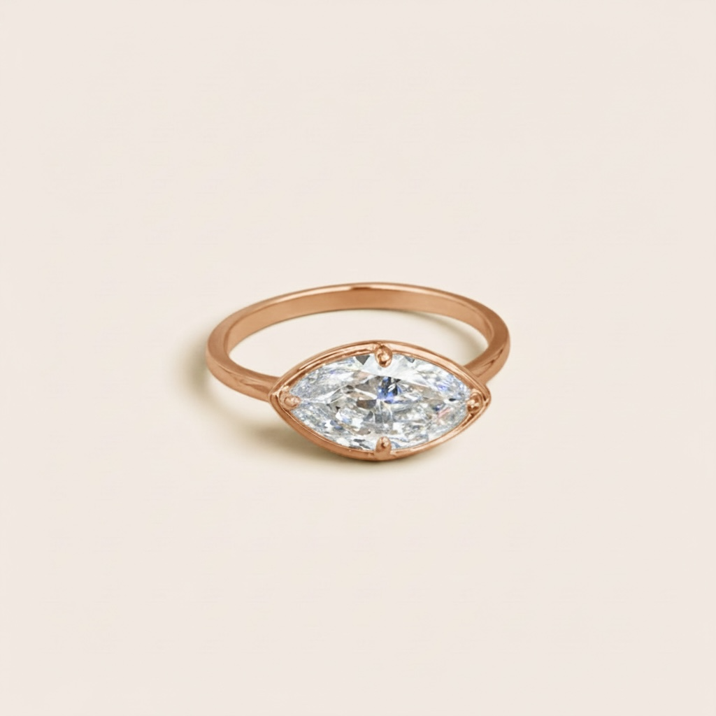 1.5 carat marquise diamond ring in solid 14K gold, featuring a modern east-west setting and delicate gold band, available in yellow gold, white gold, and rose gold.