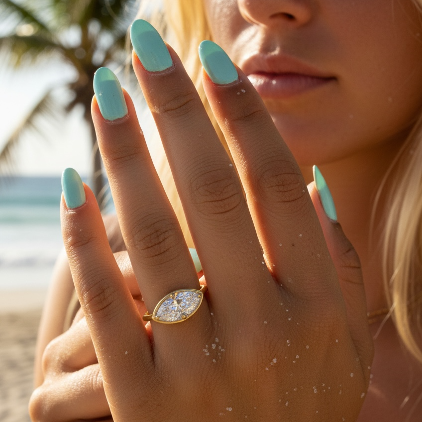 1.5 carat marquise diamond ring in solid 14K gold, featuring a modern east-west setting and delicate gold band, available in yellow gold, white gold, and rose gold.